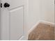 A doorway leads into the home, which is carpeted with white trim at 5384 Heron Bay Blvd, Locust Grove, GA 30248