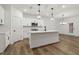 Modern kitchen with white cabinets, stainless steel appliances, and an island at 5384 Heron Bay Blvd, Locust Grove, GA 30248