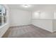 This loft has a cozy carpet and a window overlooking the outdoors at 5384 Heron Bay Blvd, Locust Grove, GA 30248
