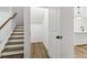 View of stairway and an under stair closet with hardwood floors at 5384 Heron Bay Blvd, Locust Grove, GA 30248