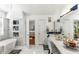 Bright bathroom with a soaking tub, marble countertops, and modern fixtures at 6219 Wurtenburg Ct, Stone Mountain, GA 30087