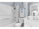 Bathroom featuring a shower/tub combo, modern fixtures and white vanity at 6219 Wurtenburg Ct, Stone Mountain, GA 30087
