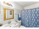 Updated bathroom features subway tile, a modern sink, and a stylish shower curtain at 6219 Wurtenburg Ct, Stone Mountain, GA 30087