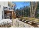Multi-level deck with stairs offers plenty of room for dining and enjoying the beautiful wooded view at 6219 Wurtenburg Ct, Stone Mountain, GA 30087