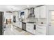 Well-appointed kitchen with white cabinetry, stainless steel appliances and stone countertops at 6219 Wurtenburg Ct, Stone Mountain, GA 30087
