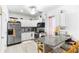 Efficient kitchen featuring modern appliances, ample counter space, and a cozy breakfast bar at 6219 Wurtenburg Ct, Stone Mountain, GA 30087