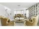 Bright living room with elegant furnishings, white marble floors and wallpaper at 6219 Wurtenburg Ct, Stone Mountain, GA 30087