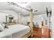 Luxury main bedroom with unique bedframe, hardwood floors, and spacious layout at 6219 Wurtenburg Ct, Stone Mountain, GA 30087