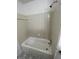 Clean bathroom features a ceramic tile surround and a shower over the tub at 498 Prince Of Wales, Stone Mountain, GA 30083