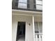 Inviting front entrance with fresh paint, modern door hardware, and neutral colors at 498 Prince Of Wales, Stone Mountain, GA 30083