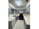 Well-lit kitchen with stainless steel appliances, and ample countertop space at 498 Prince Of Wales, Stone Mountain, GA 30083