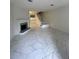 Bright living area with fireplace, tile floors, and staircase at 498 Prince Of Wales, Stone Mountain, GA 30083