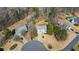 Charming home on cul-de-sac, showcasing well-maintained landscaping and a large, private backyard outlined in yellow at 7880 Brands Hatch Blvd, Cumming, GA 30040