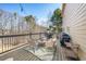 Entertaining deck with patio furniture, outdoor grill, and decorative string lights for outdoor relaxation at 7880 Brands Hatch Blvd, Cumming, GA 30040