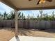 A covered patio looks out to a fenced backyard, providing a private outdoor space at 3988 Two Bridge Drive, Buford, GA 30519