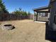 Backyard with a fire pit, patio, and fenced yard at 3988 Two Bridge Drive, Buford, GA 30519