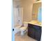 Bathroom with a shower-tub combo, modern vanity, and tile flooring at 3988 Two Bridge Drive, Buford, GA 30519