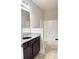Cozy bathroom featuring a single vanity with granite countertop and a shower-tub combination at 3988 Two Bridge Drive, Buford, GA 30519