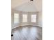 Bright bedroom with vaulted ceiling and three large windows offering plenty of natural light at 3988 Two Bridge Drive, Buford, GA 30519