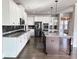 Spacious kitchen featuring a large island, granite counters, stainless appliances and bright white cabinets at 3988 Two Bridge Drive, Buford, GA 30519