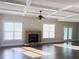 Open concept living room with stone fireplace, coffered ceilings, and French doors at 3988 Two Bridge Drive, Buford, GA 30519