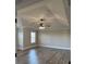 Primary bedroom with tray ceiling, hardwood floors, neutral walls, and lots of natural light at 3988 Two Bridge Drive, Buford, GA 30519