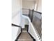 Staircase with carpeted steps and an ornate wrought iron railing at 3988 Two Bridge Drive, Buford, GA 30519