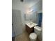 Bathroom featuring a wood vanity, white toilet, and neutral wall paint at 465 Prince Of Wales, Stone Mountain, GA 30083