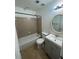 Well-lit bathroom with a tub-shower combo and a stylish vanity at 465 Prince Of Wales, Stone Mountain, GA 30083