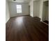 Spacious bedroom featuring a large window and laminate wood flooring at 465 Prince Of Wales, Stone Mountain, GA 30083