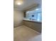 This dining area has wood look tile and is adjacent to the kitchen with a breakfast bar at 465 Prince Of Wales, Stone Mountain, GA 30083