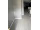 Entryway with gray walls, light wood look floors and a glimpse of a Gathering room beyond at 465 Prince Of Wales, Stone Mountain, GA 30083
