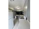 This kitchen has light gray cabinets, stainless dishwasher, and white countertops at 465 Prince Of Wales, Stone Mountain, GA 30083