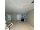 Bright living room features modern floors, statement fireplace, and wall to wall mirrors at 465 Prince Of Wales, Stone Mountain, GA 30083
