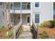 Close up exterior view of a doorway with access via steps and a walkway with views of garden landscape at 1321 Keys Lake Ne Dr, Brookhaven, GA 30319
