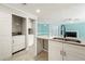 Open concept kitchen featuring stainless steel sink, granite countertops, and laundry room at 1321 Keys Lake Ne Dr, Brookhaven, GA 30319