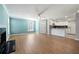 Light-filled living room seamlessly connects to kitchen with breakfast bar with access to exterior at 1321 Keys Lake Ne Dr, Brookhaven, GA 30319