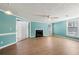 Bright living room featuring wood floors, fireplace, and access to sun room at 1321 Keys Lake Ne Dr, Brookhaven, GA 30319