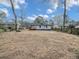 Large backyard with mature trees, and a partial fence-line at 2195 Burroughs Ave, Atlanta, GA 30315