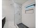 Modern bathroom featuring a tiled shower with sleek fixtures and a double vanity at 2195 Burroughs Ave, Atlanta, GA 30315
