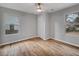 Cozy bedroom featuring hardwood floors, ceiling fan, and natural light at 2195 Burroughs Ave, Atlanta, GA 30315