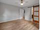 Spacious bedroom featuring hardwood floors, a ceiling fan, and modern sliding door at 2195 Burroughs Ave, Atlanta, GA 30315