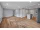 Spacious living room showcasing hardwood floors, recessed lighting, and an open layout at 2195 Burroughs Ave, Atlanta, GA 30315