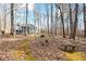 Backyard moss path leads to secluded bench near the home at 285 Blackstock Rd, Villa Rica, GA 30180