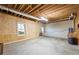Unfinished basement area with window, door, wooden beams, and exposed duct work at 285 Blackstock Rd, Villa Rica, GA 30180