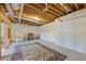Unfinished basement featuring exposed duct work, wooden beams, and a colorful rug at 285 Blackstock Rd, Villa Rica, GA 30180