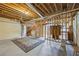 The unfinished basement with exposed framing provides a canvas for future living space at 285 Blackstock Rd, Villa Rica, GA 30180