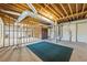 The unfinished basement with exposed beams and duct work also features the home's water heater at 285 Blackstock Rd, Villa Rica, GA 30180