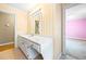 Bathroom vanity with a white countertop and lots of cabinet space, plus a view of the pink bedroom at 285 Blackstock Rd, Villa Rica, GA 30180