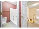 Bathroom featuring shower, toilet, and decorative wallpaper at 285 Blackstock Rd, Villa Rica, GA 30180